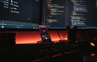 a keyboard with a dark screen with code lines
